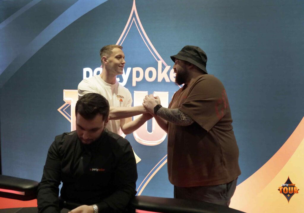 Ronnie Marland and Deniz Orhan sealing the deal. Photo: PartyPoker
