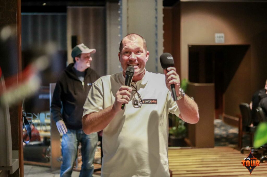 Glenn Brown announcing the players were in the money during Day 2 of the £150 Mini Main Event. Photo: PartyPoker